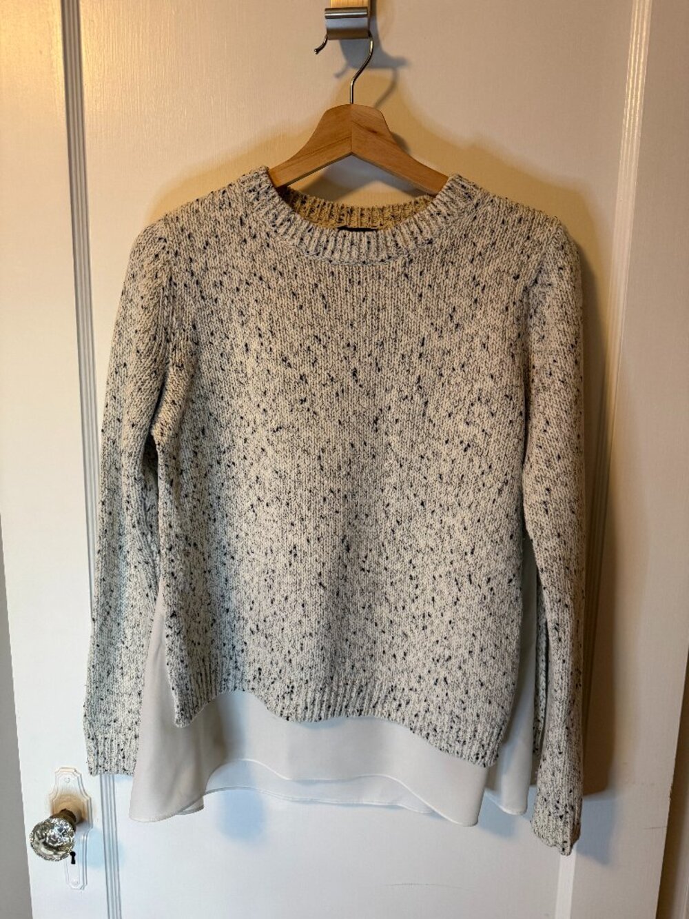 Club Monaco speckled mixed-media layered sweater.